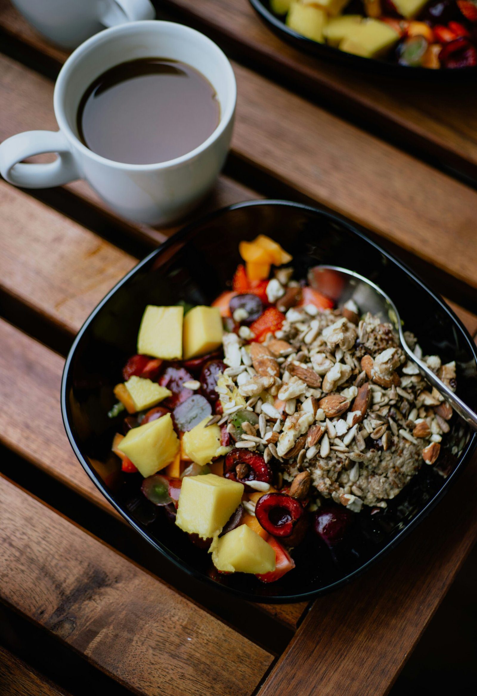 ceramic bowl beside white ceramic mug